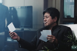 Choi Min-sik, as Section Chief Kang